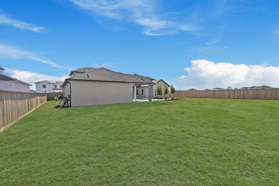 Exterior details and patio area of a home in Bridgeland, Cypress (Image 29).