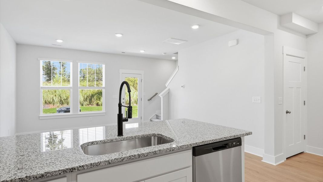 Luxury-inspired kitchen featuring expansive prep space and elegant design elements near Lake Hartwell Luxury-inspired kitchen featuring expansive prep space and elegant design elements near Lake Hartwell