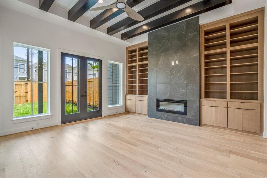 Another view of your living space and the double French doors leading to your covered backyard patio.