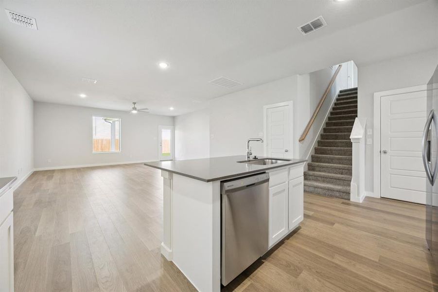 Kitchen in the Haylee home plan by Trophy Signature Homes - REPRESENTATIVE PHOTO