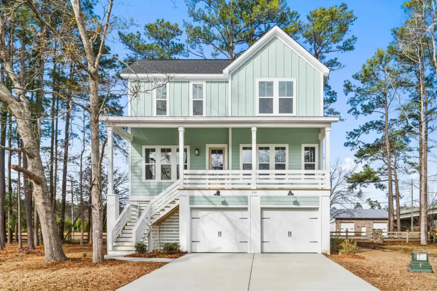 Front exterior of a new home in Harbor Oaks Marina, Myrtle Beach, SC, highlighting curb appeal (Image 1). Front exterior of a new home in Harbor Oaks Marina, Myrtle Beach, SC, highlighting curb appeal (Image 1).