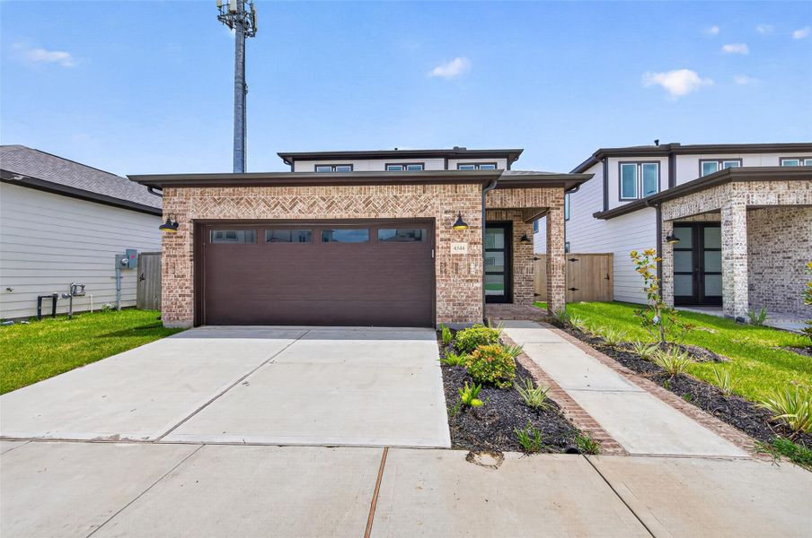 Front exterior of a new home in , Stafford, TX, highlighting curb appeal (Image 26). Front exterior of a new home in , Stafford, TX, highlighting curb appeal (Image 26).