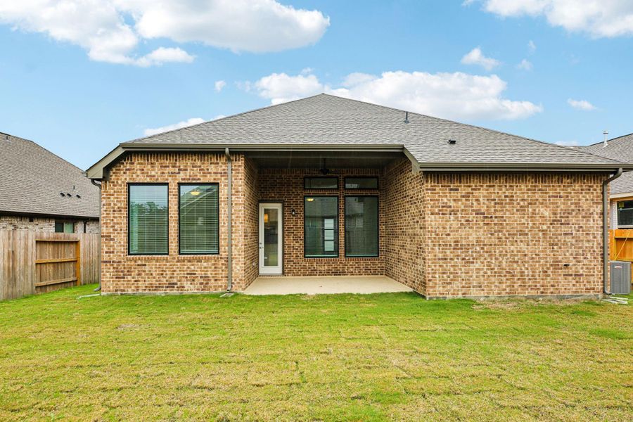 Exterior details and patio area of a home in The Trails, New Caney (Image 23).
