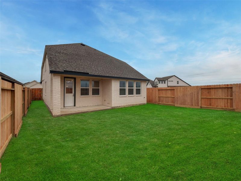 Exterior details and patio area of a home in Oakberry Trails, Waller (Image 24).