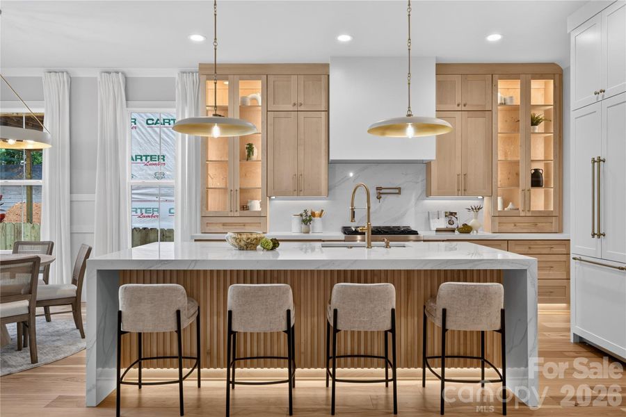 Not pot filler, gas cooktop and large eat in island