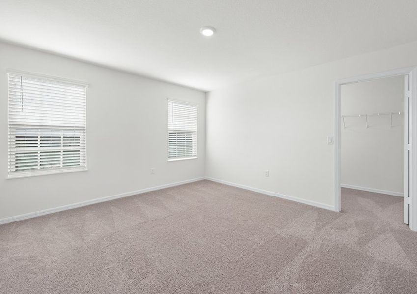 This master bedroom is flooded with natural light