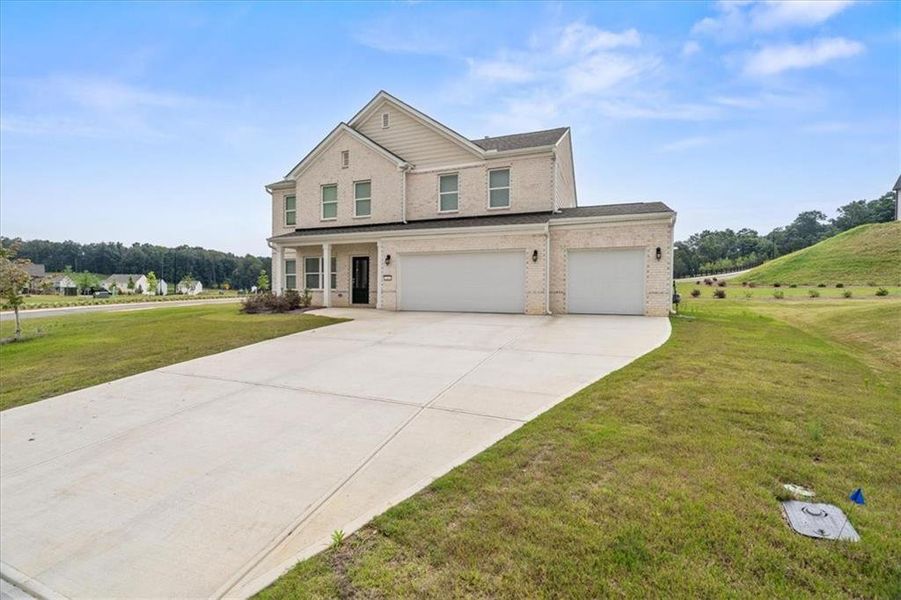 Front exterior of a new home in , Calhoun, GA, highlighting curb appeal (Image 25). Front exterior of a new home in , Calhoun, GA, highlighting curb appeal (Image 25).
