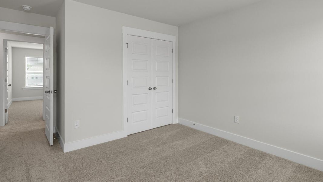 Spacious, unfurnished interior of a new home in Surfside Landing, Hubert (Image 28).
