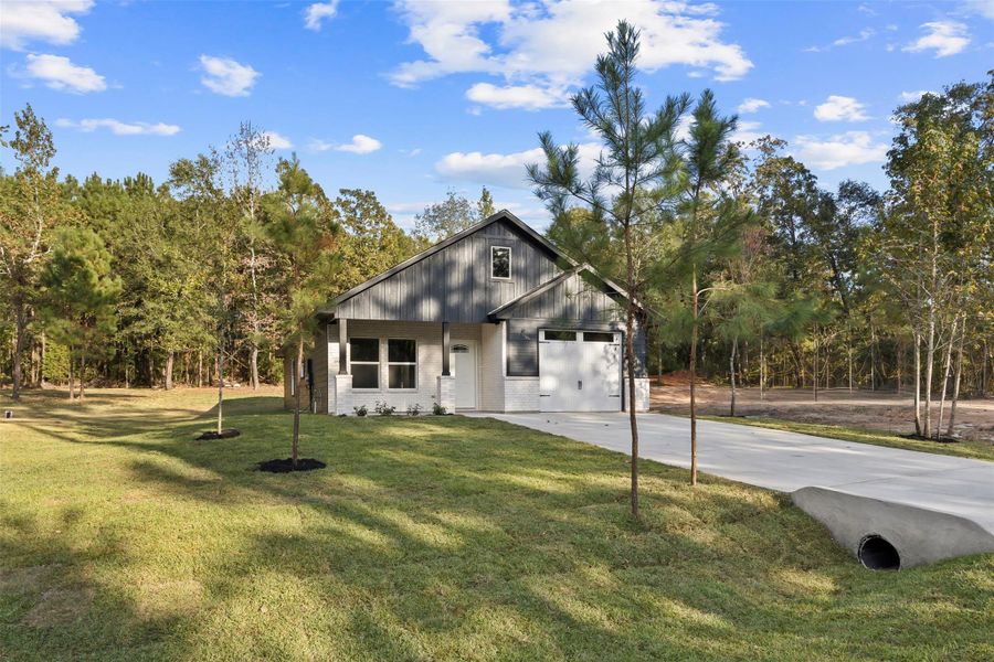 Exterior details and patio area of a home in , Willis (Image 4). Exterior details and patio area of a home in , Willis (Image 4).