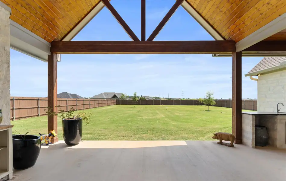 MAZING VAULTED COVERED BACK PORCH with built in outdoor kitchen including GRILL AND SINK. MAZING VAULTED COVERED BACK PORCH with built in outdoor kitchen including GRILL AND SINK.