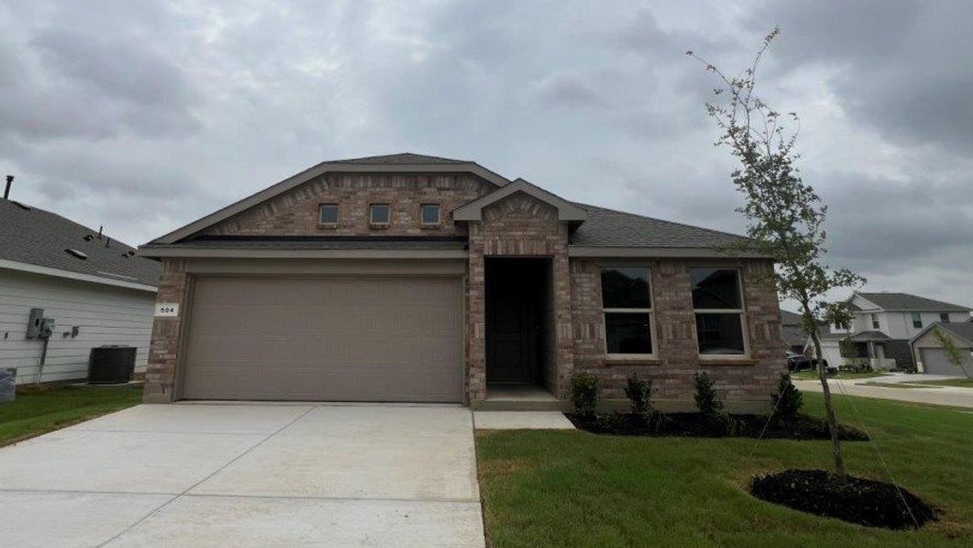 Front exterior of a new home in Monarch at the Meadows, Ponder, TX, highlighting curb appeal (Image 1). Front exterior of a new home in Monarch at the Meadows, Ponder, TX, highlighting curb appeal (Image 1).