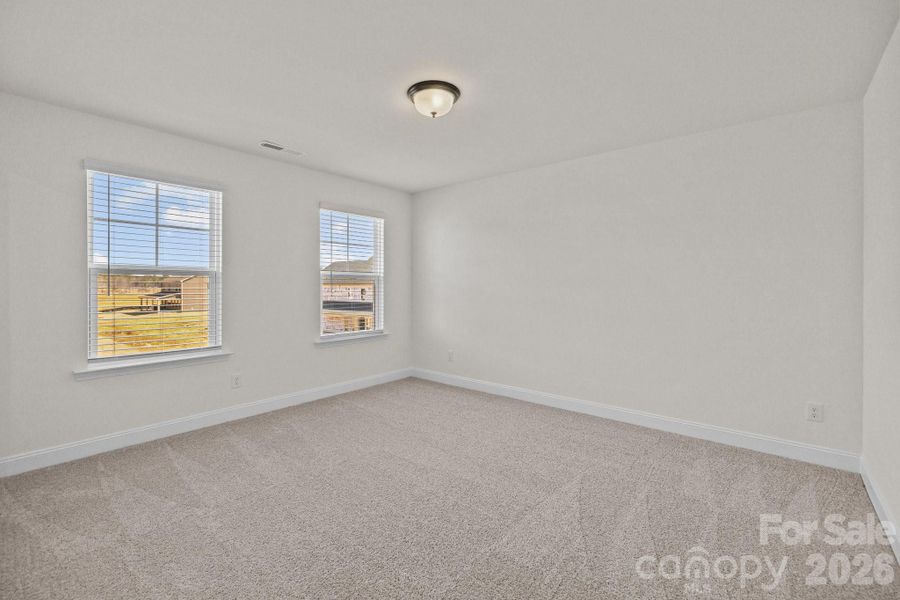 Secondary BedroomPhotos are representative and may not reflect the exact home, finishes, or features.
