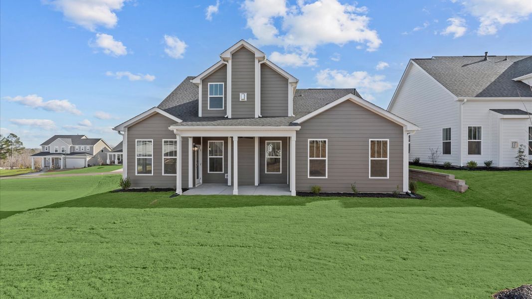 Established charm meets functional outdoor living with a spacious rear covered porch