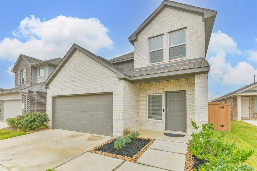 Front exterior of a new home in Cypress Green, Hockley, TX, highlighting curb appeal (Image 2). Front exterior of a new home in Cypress Green, Hockley, TX, highlighting curb appeal (Image 2).