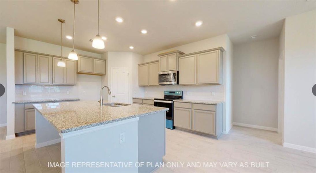 Kitchen with tasteful backsplash, a kitchen island with sink, light stone counters, appliances with stainless steel finishes, and a sink Kitchen with tasteful backsplash, a kitchen island with sink, light stone counters, appliances with stainless steel finishes, and a sink