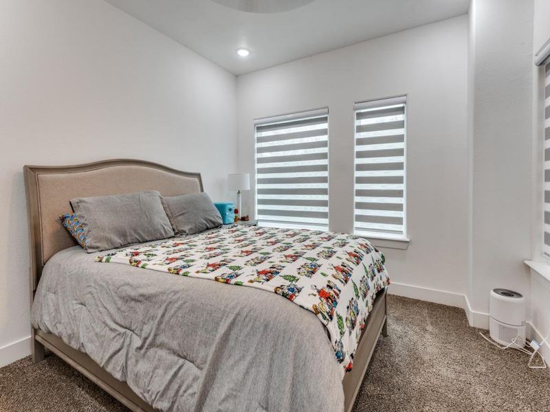 Bedroom with carpet flooring and recessed lighting