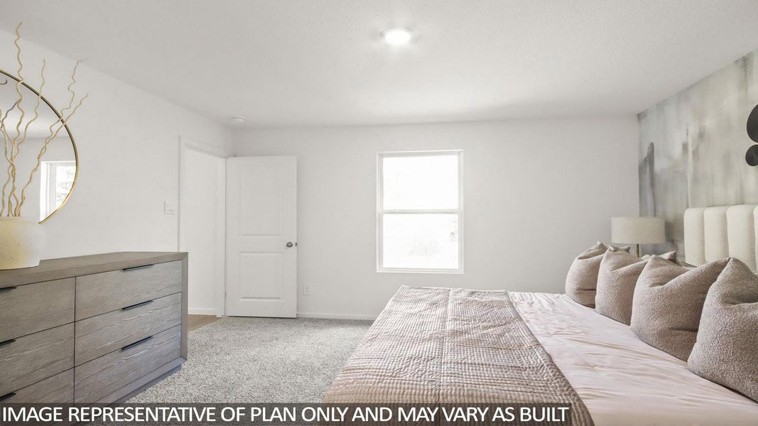 Bedroom with light colored carpet and baseboards
