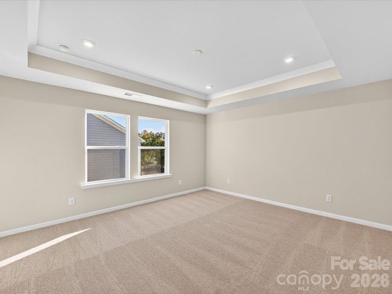 Primary Suite with Tray Ceiling and Bright Sunny Windows. Primary Suite with Tray Ceiling and Bright Sunny Windows.