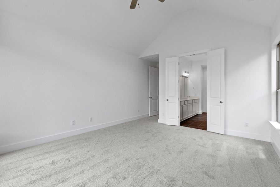 Primary Bedroom with elevated ceiling Primary Bedroom with elevated ceiling