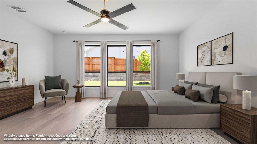 Bedroom with wood finished floors and baseboards