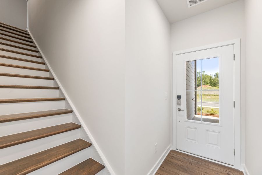 A staircase leading to a door.