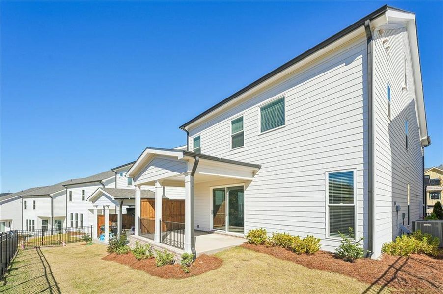 Exterior details and patio area of a home in Palisades Single Family, Cumming (Image 3).