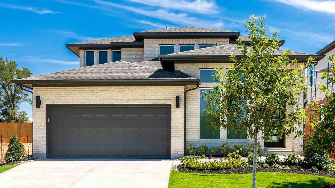 View of front of home featuring a shingled roof, a garage, concrete driveway, and brick siding View of front of home featuring a shingled roof, a garage, concrete driveway, and brick siding