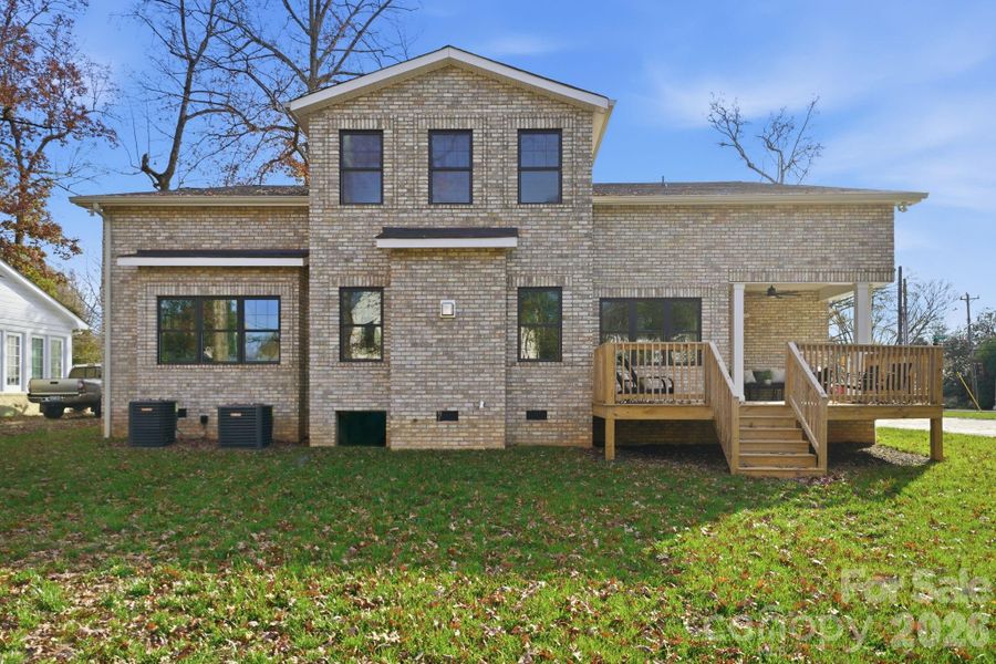 Rear elevation showcasing the expansive backyard – perfect for year-round outdoor living Rear elevation showcasing the expansive backyard – perfect for year-round outdoor living