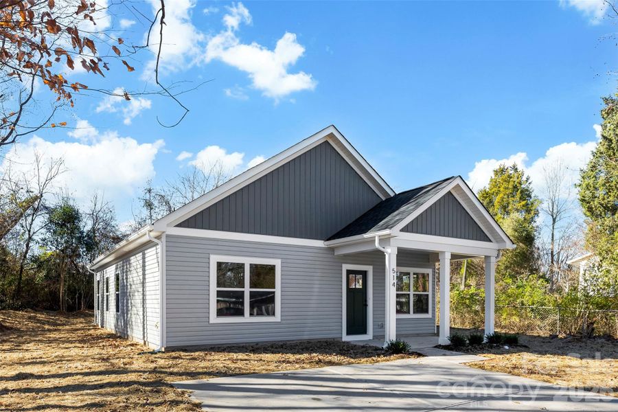 Front exterior of a new home in , East Spencer, NC, highlighting curb appeal (Image 24).