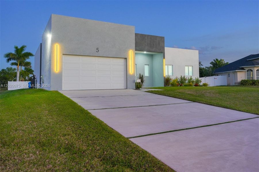 Front exterior of a new home in , Cape Coral, FL, highlighting curb appeal (Image 30). Front exterior of a new home in , Cape Coral, FL, highlighting curb appeal (Image 30).