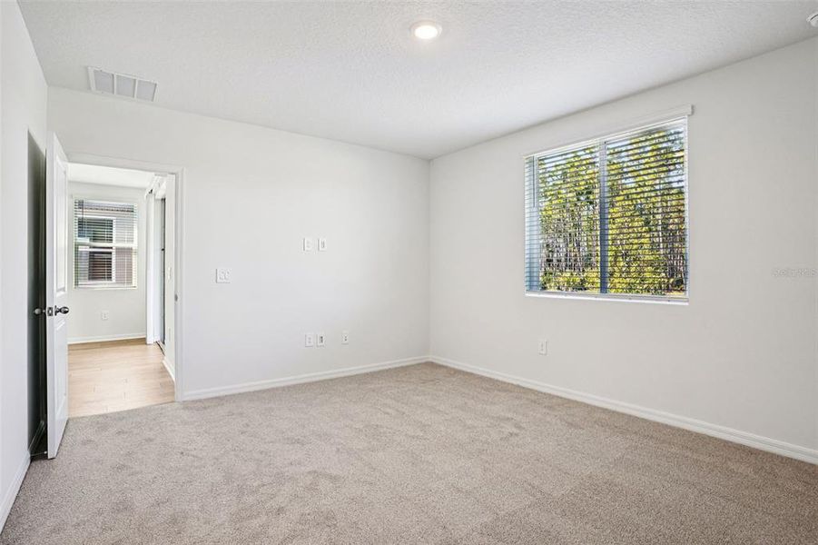 Spacious, unfurnished interior of a new home in Ridgehaven - Villas, Ormond Beach (Image 31).