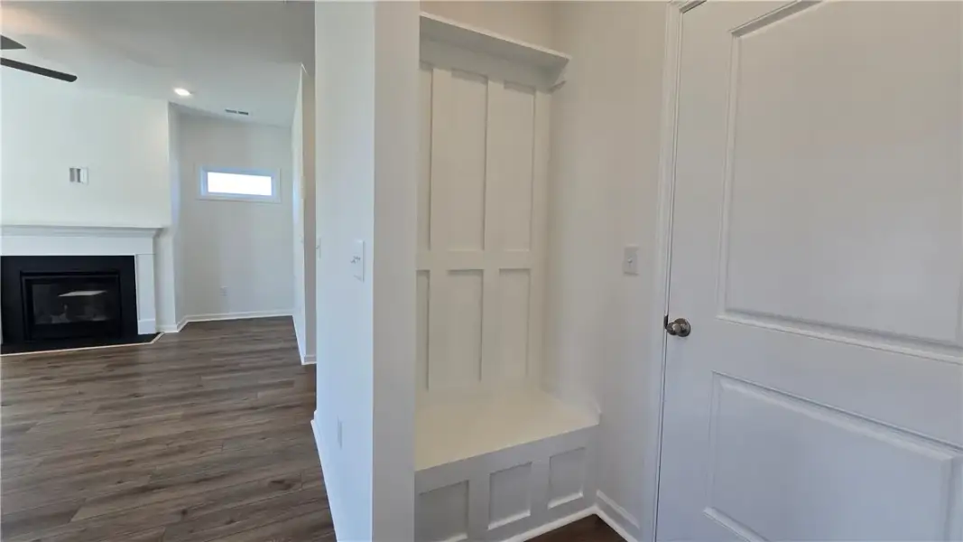 An inviting entryway alcove with a built-in bench