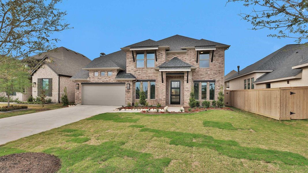 Front exterior of a new home in Grange, Katy, TX, highlighting curb appeal (Image 1). Front exterior of a new home in Grange, Katy, TX, highlighting curb appeal (Image 1).