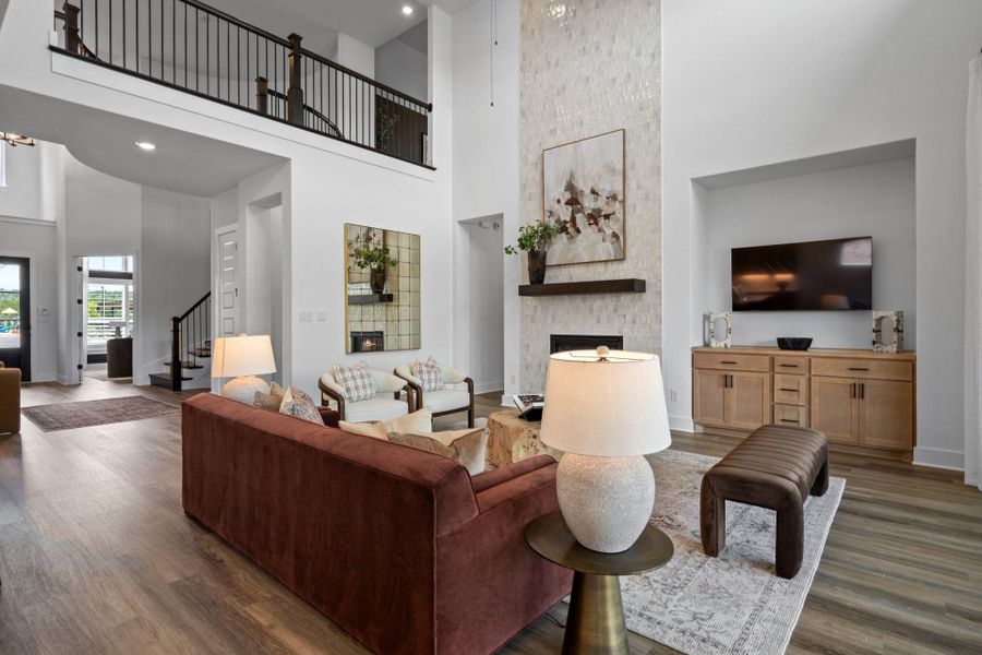 Family Room with soaring ceiling & fireplace