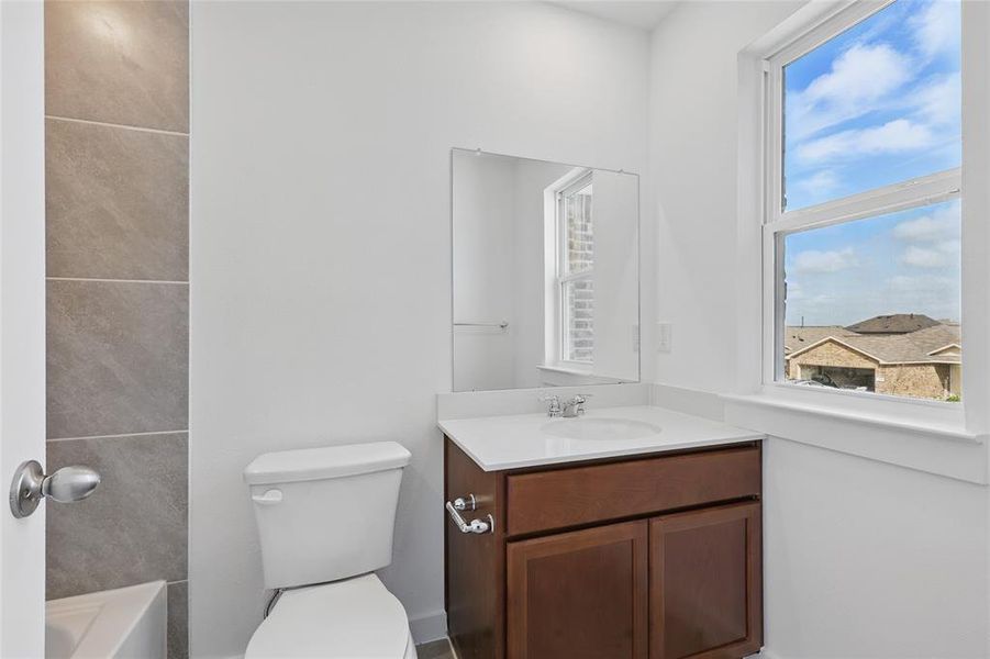Full bathroom featuring vanity, a tub to relax in, and a shower Full bathroom featuring vanity, a tub to relax in, and a shower