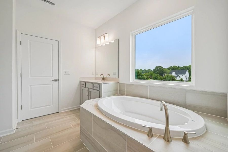 Primary Bath featuring the AW Collection® Milan - Clean geometry and high-contrast finishes. Primary Bath featuring the AW Collection® Milan - Clean geometry and high-contrast finishes.