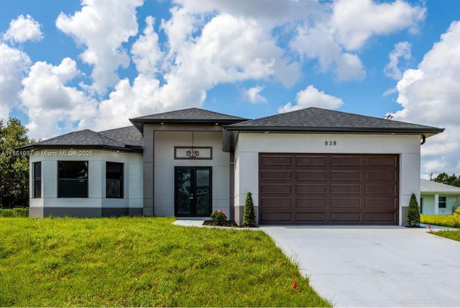 Front exterior of a new home in , Lehigh Acres, FL, highlighting curb appeal (Image 22). Front exterior of a new home in , Lehigh Acres, FL, highlighting curb appeal (Image 22).
