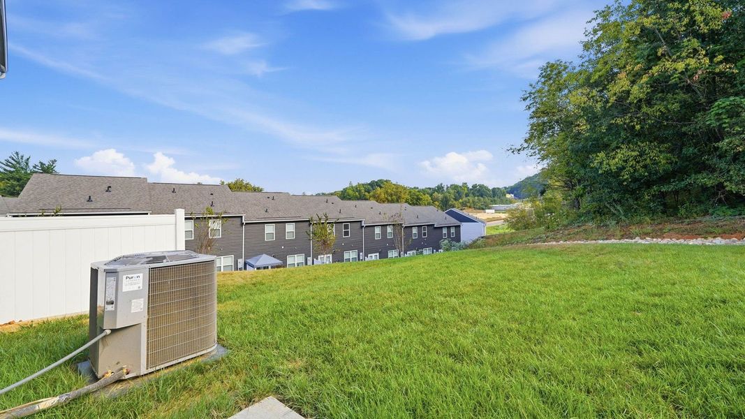 Exterior details and patio area of a home in The Arbor Townhomes, Kingsport (Image 3).