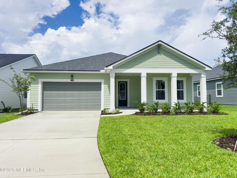 Front exterior of a new home in RiverTown - Ravines, St. Johns, FL, highlighting curb appeal (Image 1).