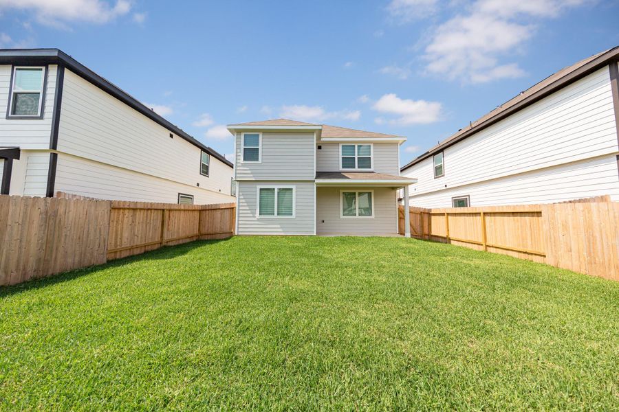 Exterior details and patio area of a home in River's Edge, Conroe (Image 2). Exterior details and patio area of a home in River's Edge, Conroe (Image 2).