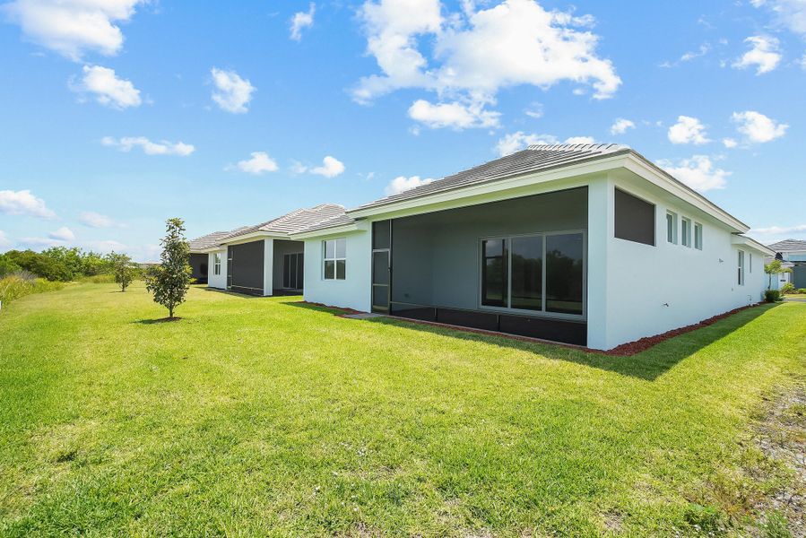 Front exterior of a new home in Lake Park at Tradition, Port St. Lucie, FL, highlighting curb appeal (Image 19).