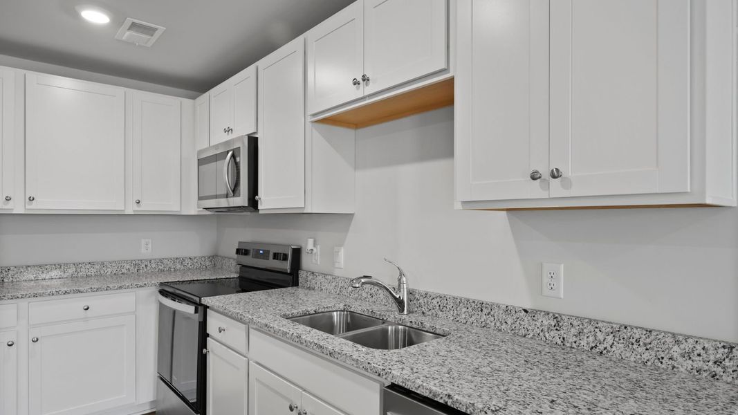 Representative furnished interior of a home built from the SULLIVAN by D.R. Horton in Center Pointe, Santee (Image 5).