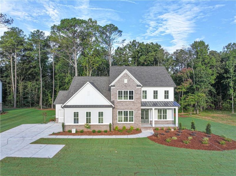 Front exterior of a new home in , Cumming, GA, highlighting curb appeal (Image 31).