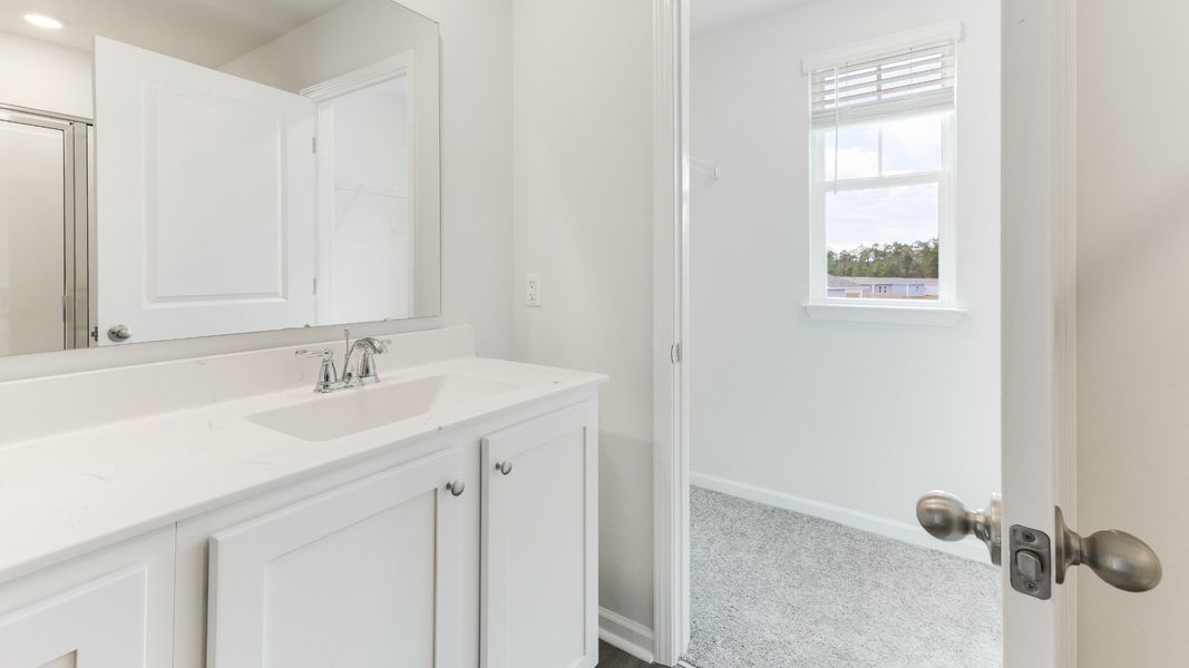 Representative furnished interior of a home built from the HAYDEN by D.R. Horton in Sidbury Station, Castle Hayne (Image 12).