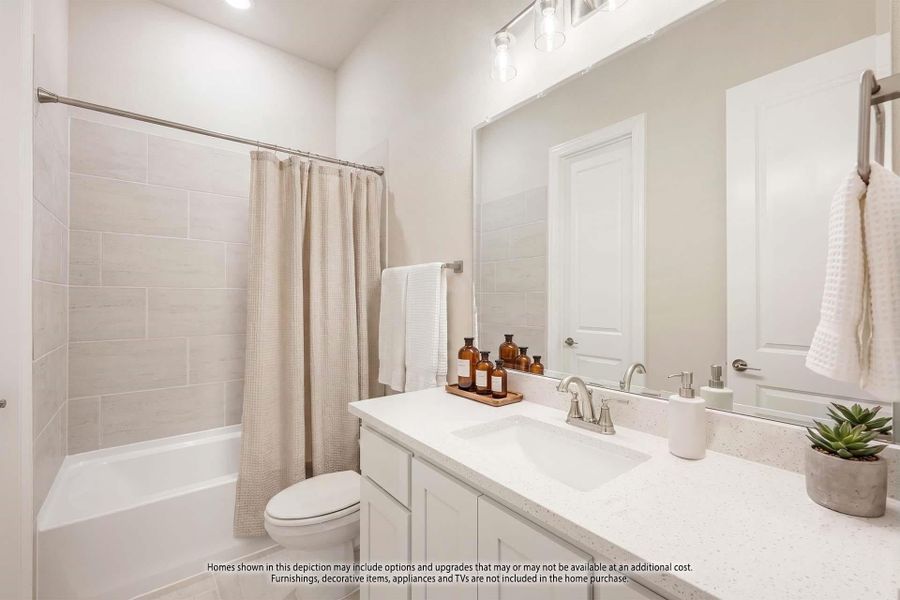 Bathroom with white vanity, quartz countertop, tub-shower combo with tile surround, and large mirror Bathroom with white vanity, quartz countertop, tub-shower combo with tile surround, and large mirror