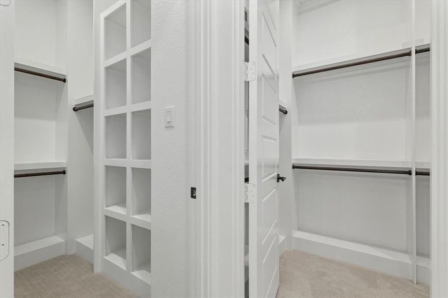 Walk in closet with light carpet Walk in closet with light carpet