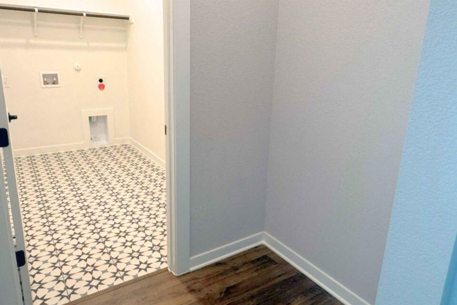 Laundry room with gas dryer hookup, dark flooring, and washer hookup Laundry room with gas dryer hookup, dark flooring, and washer hookup