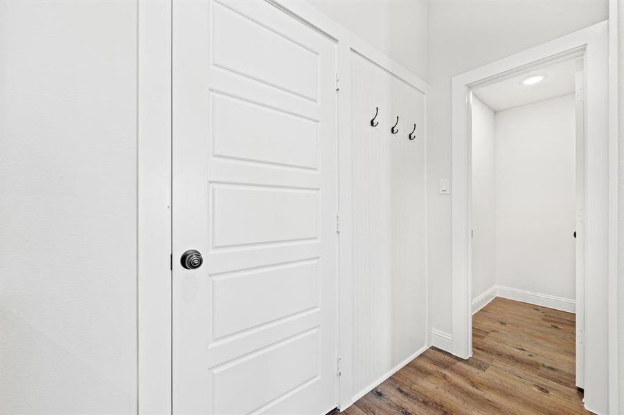 Mudroom featuring wood-type flooring