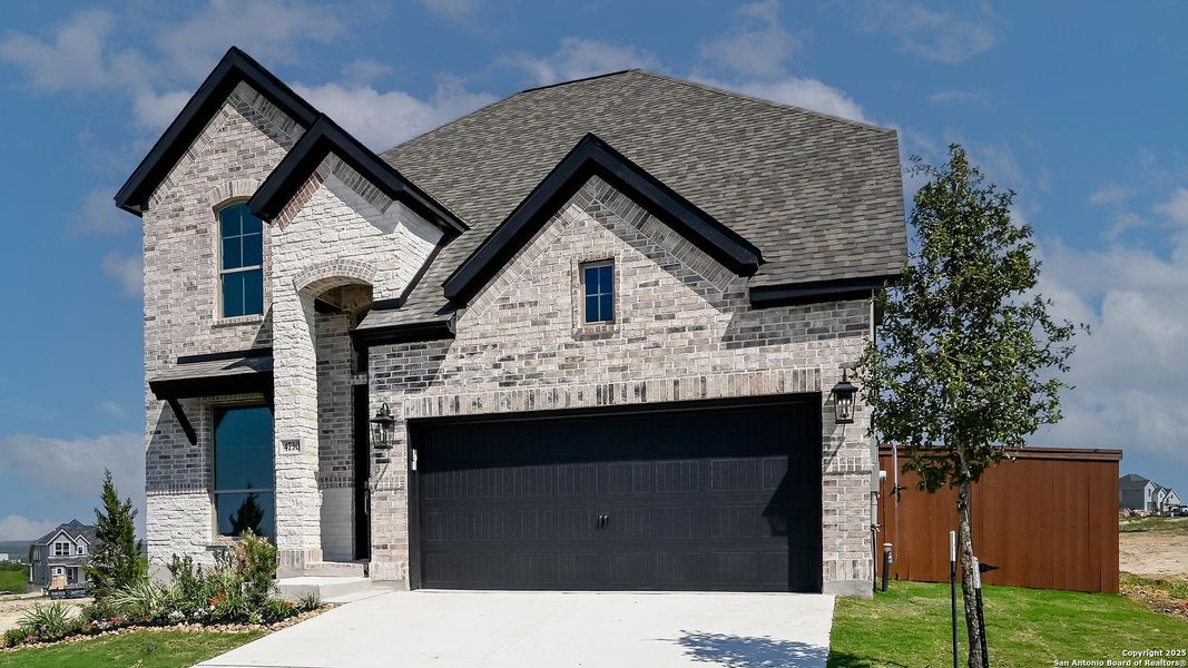 Front exterior of a new home in Homestead 55', Schertz, TX, highlighting curb appeal (Image 17).