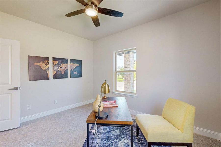 Carpeted office with ceiling fan